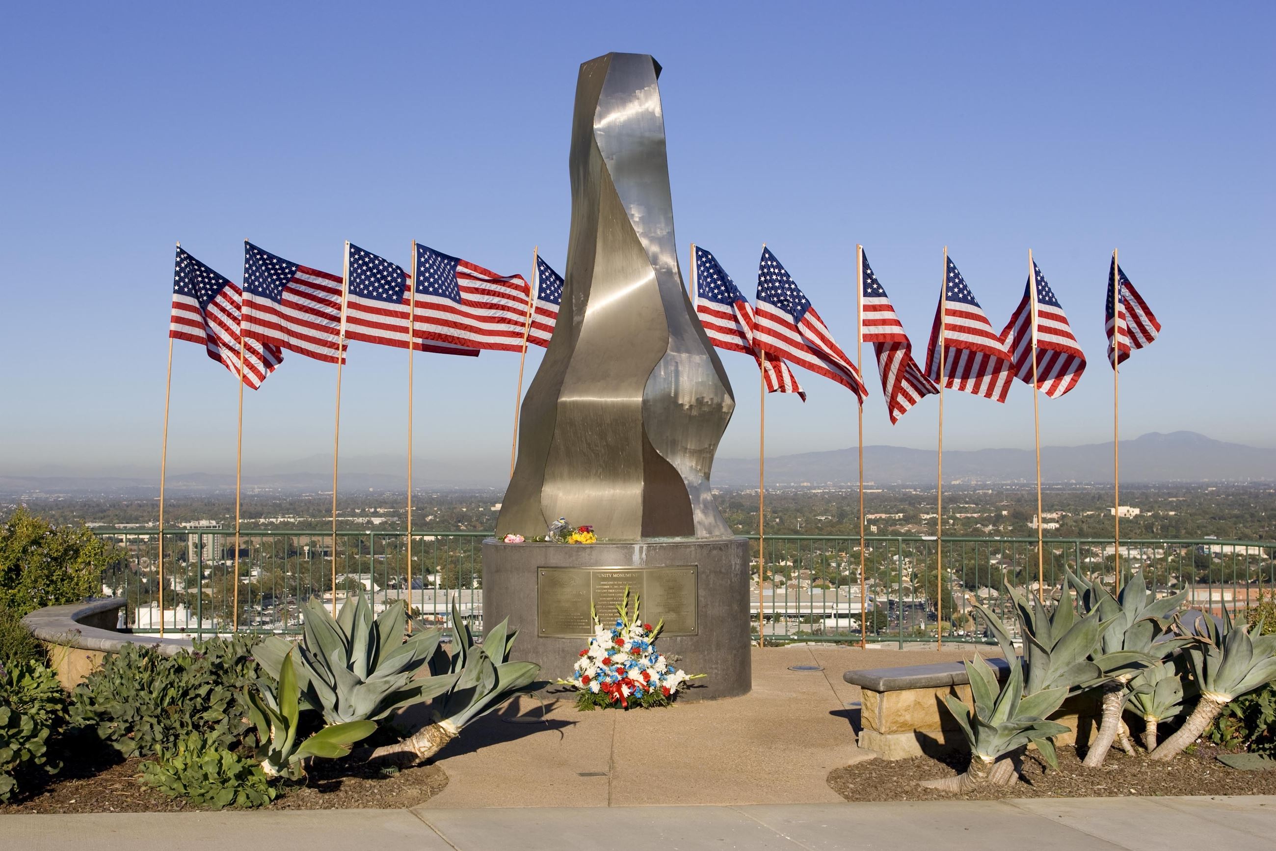 Unity Monument with American flags and flowers