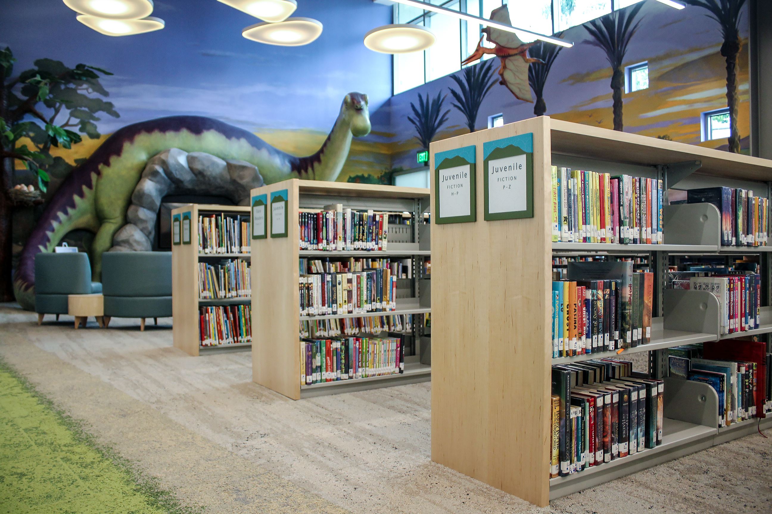 Dinosaur with Shelves of Books