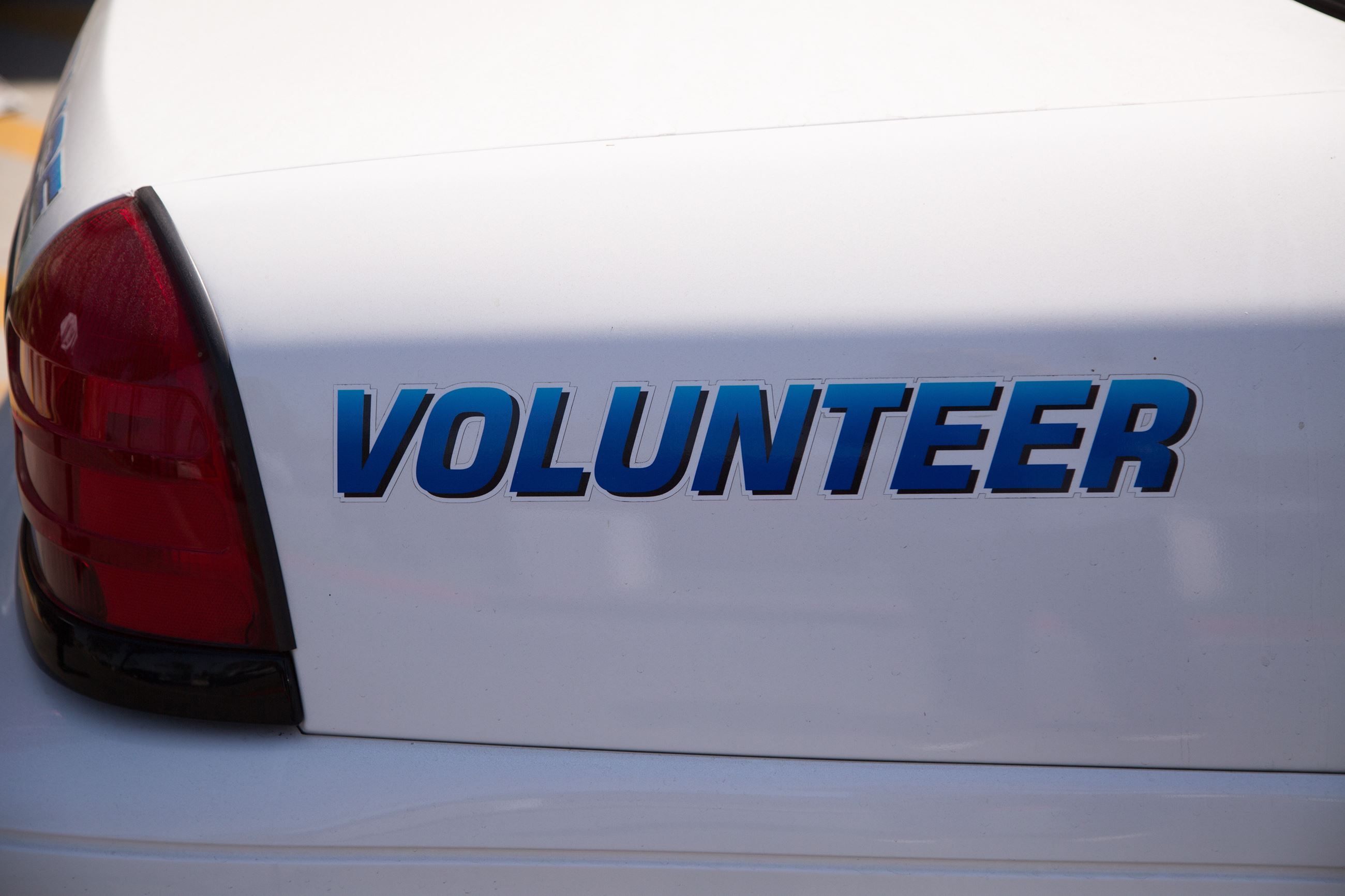 Back of Police Car that reads volunteer